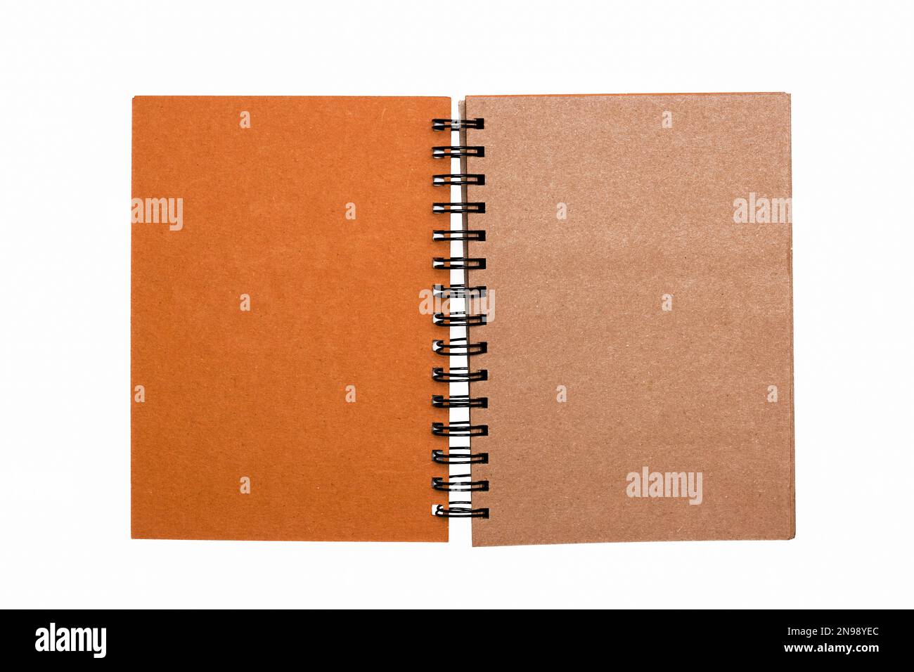 Notebook, with place for your image, text or corporate identity details. Blank with shadow on whitebackground. Spiral notepad on a table. Flat lay, to Stock Photo