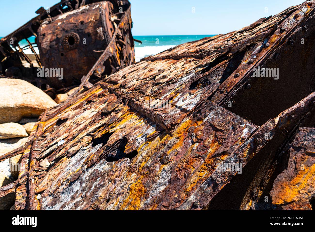 The wreck of the Aristea lies on the rocks on the Atlantic Ocean coast near Hondeklip Bay in South Africa. The ship ran aground in 1945 and corrodes. Stock Photo