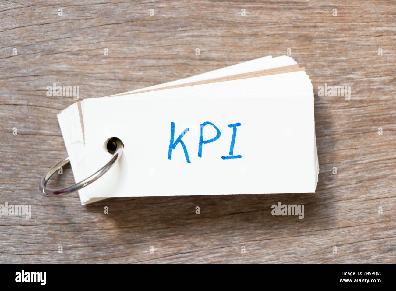 Flash card with handwriting in word KPI (Abbreviation of key