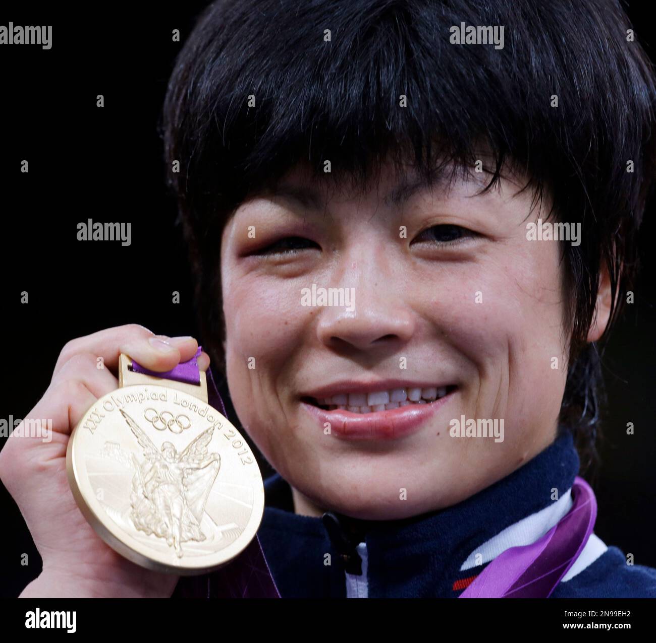 Gold medalist Hitomi Obara of Japan, shows her medal during the awards
