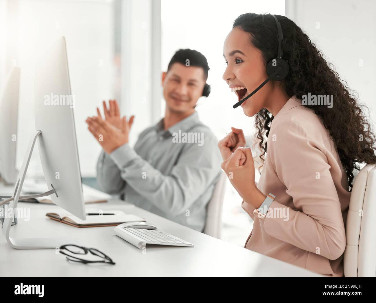 Success comes to those who work hard. two young call center agents