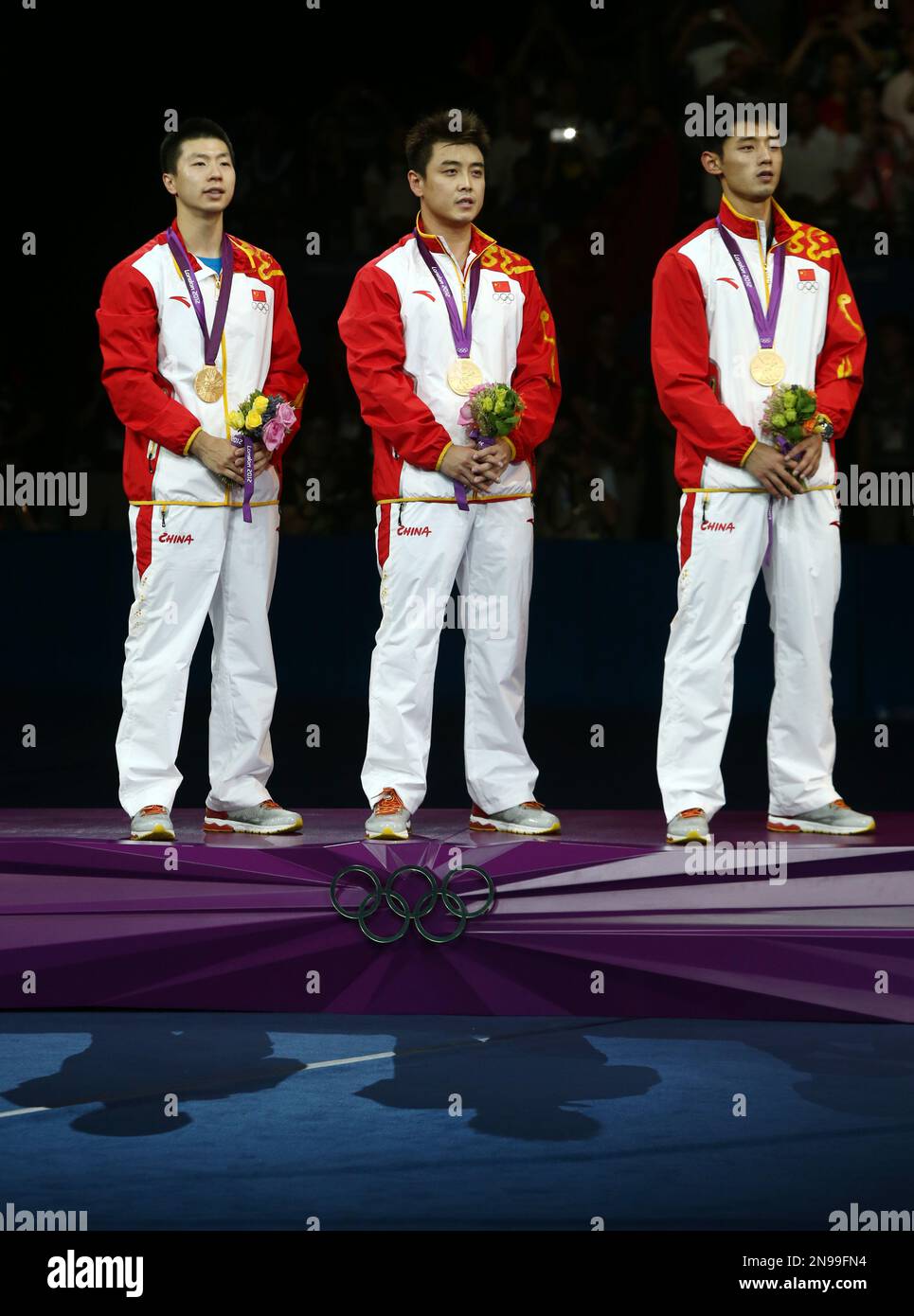 Gold medalists from left to right, Ma Long, Wang Hao and Zhang Jike of