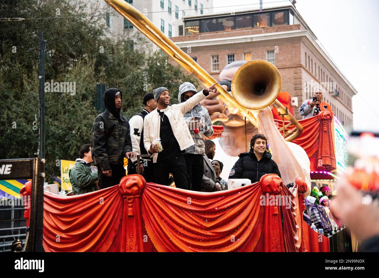 Trombone Shorty is seen during the Krewe of Freret parade passing the
