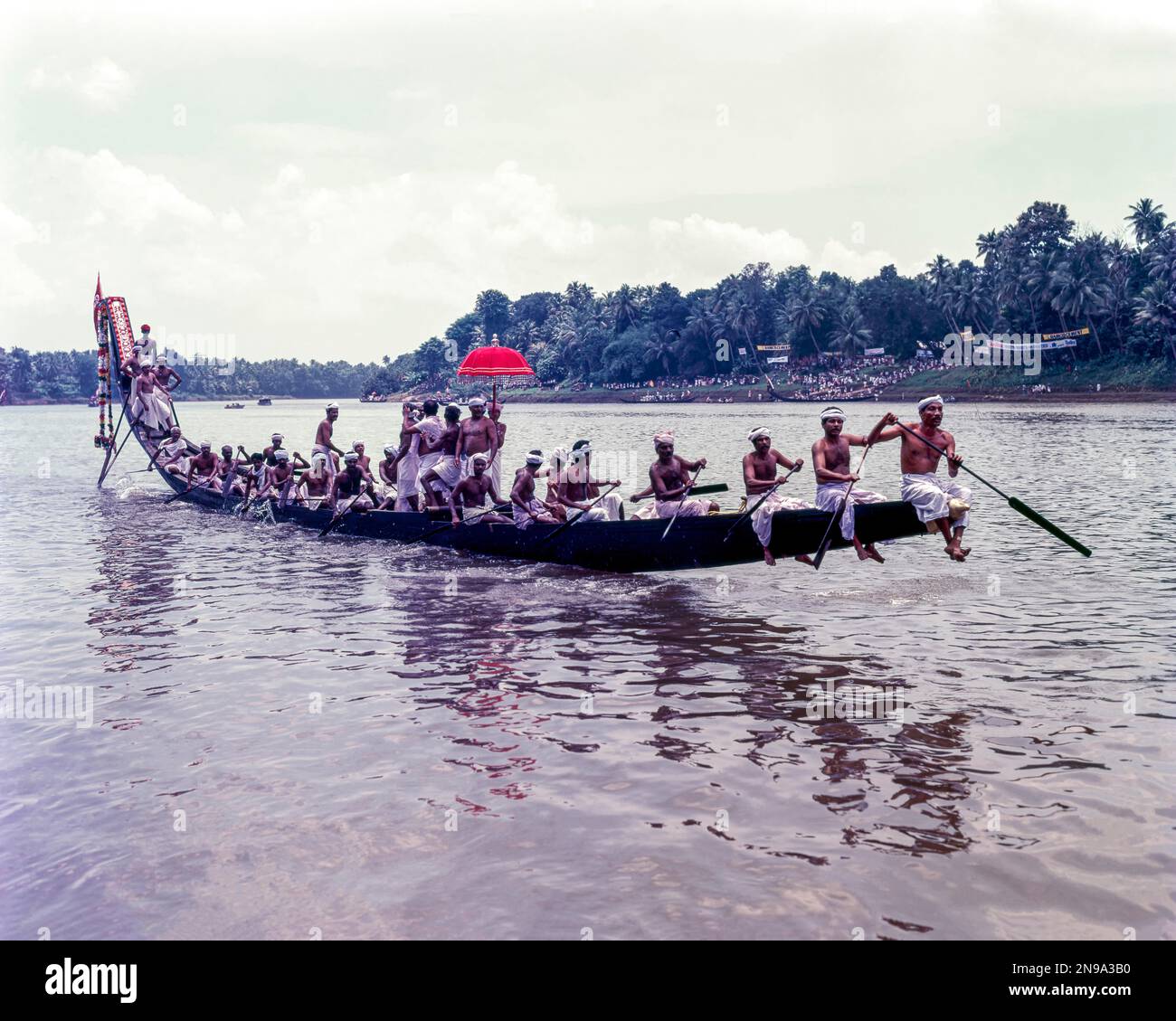 The colourful umbrellas taken in the boats by men in their traditional