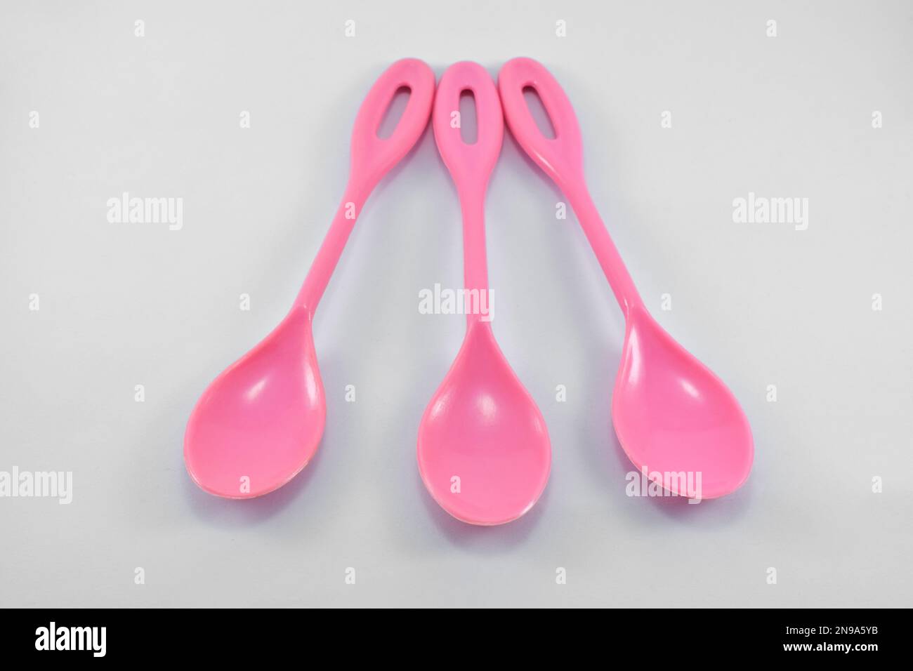 multicolored plastic measuring spoons in grams isolated on white Stock  Photo - Alamy
