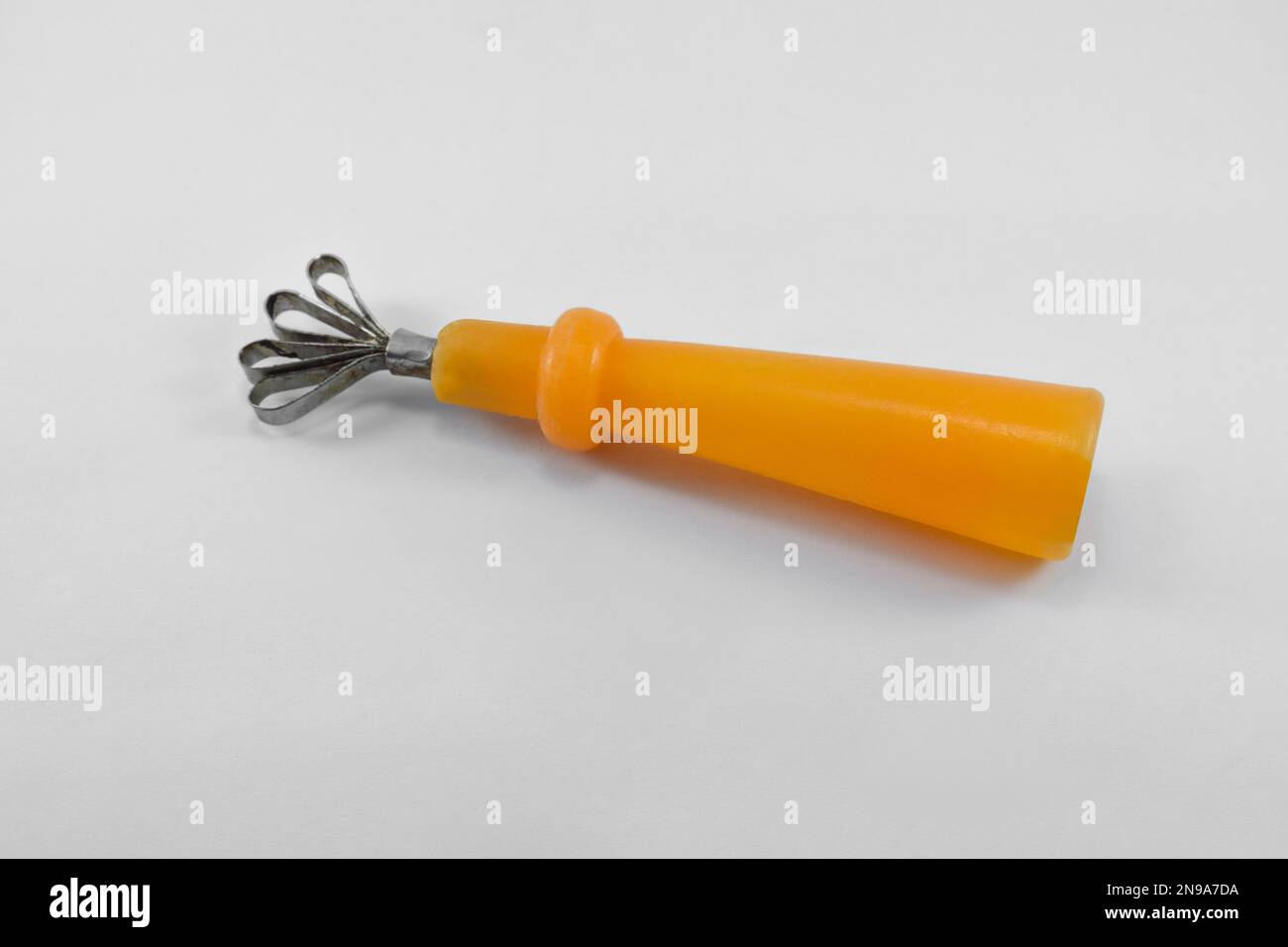 Peeler used for cantaloupe or coconut fruit on an isolated white