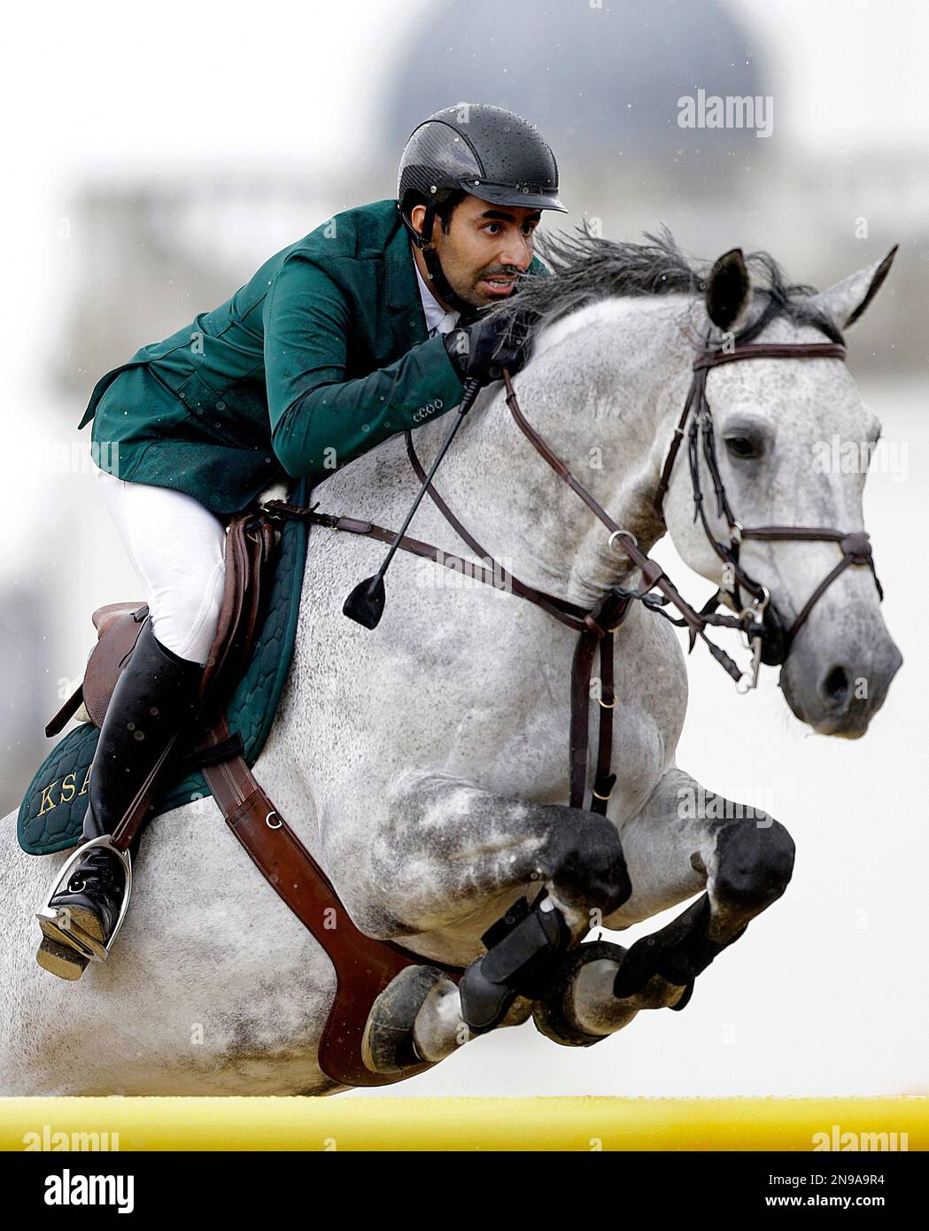 Prince Abdullah Al Saud, of Saudi Arabia, rides his horse Davos in the equestrian show jumping team competition at the 2012 Summer Olympics, Sunday, Aug