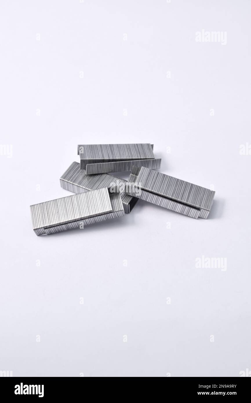 Pile of metal staples for stapler isolated on white background Stock