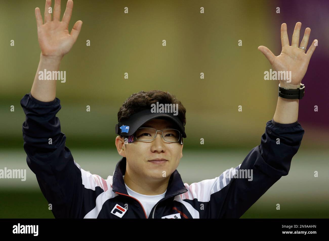 South Korea's Jin Jongoh waves as he is introduced at the start of the