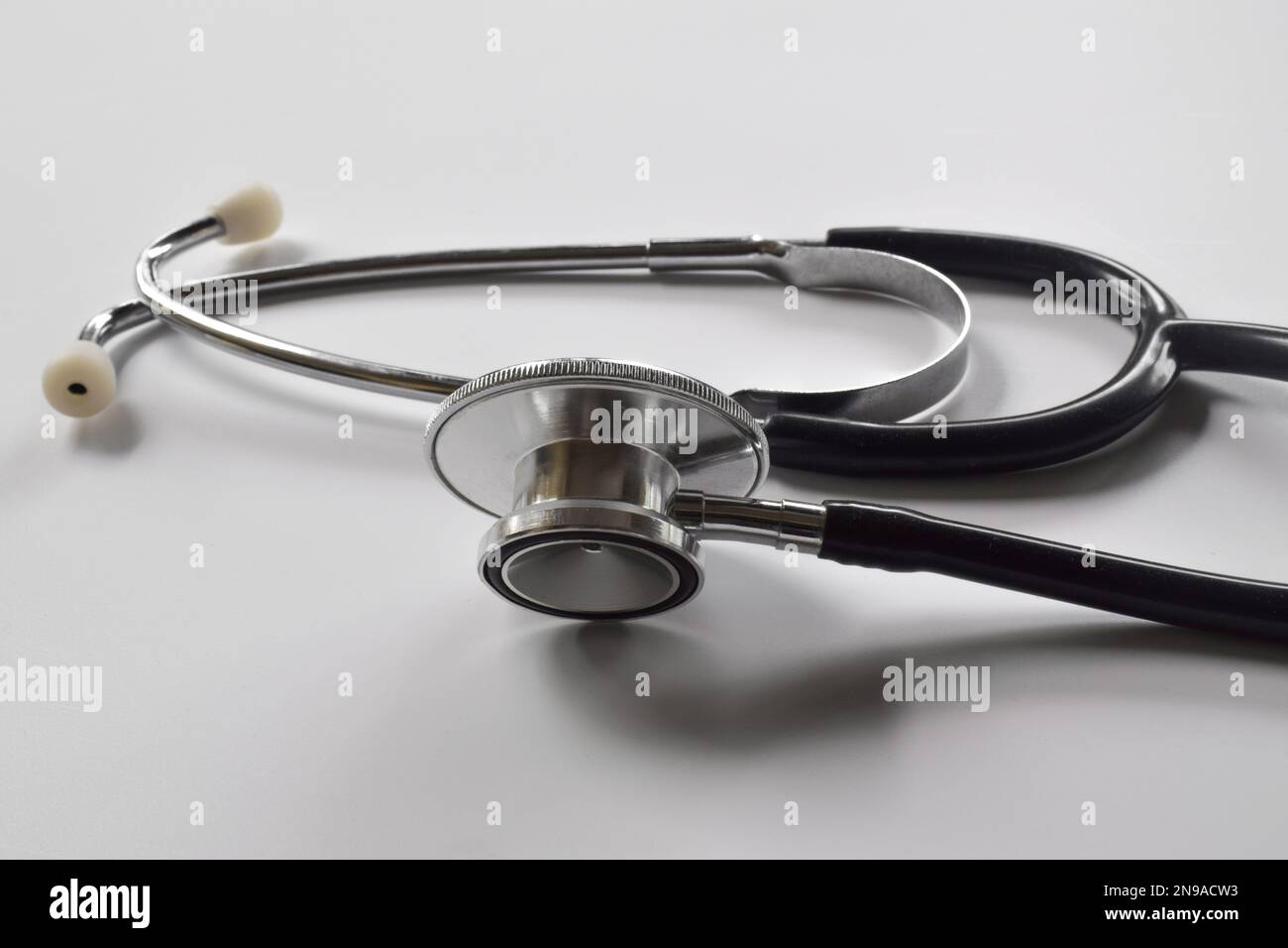 Black stethoscope isolated on white background. Healthcare Stock Photo ...