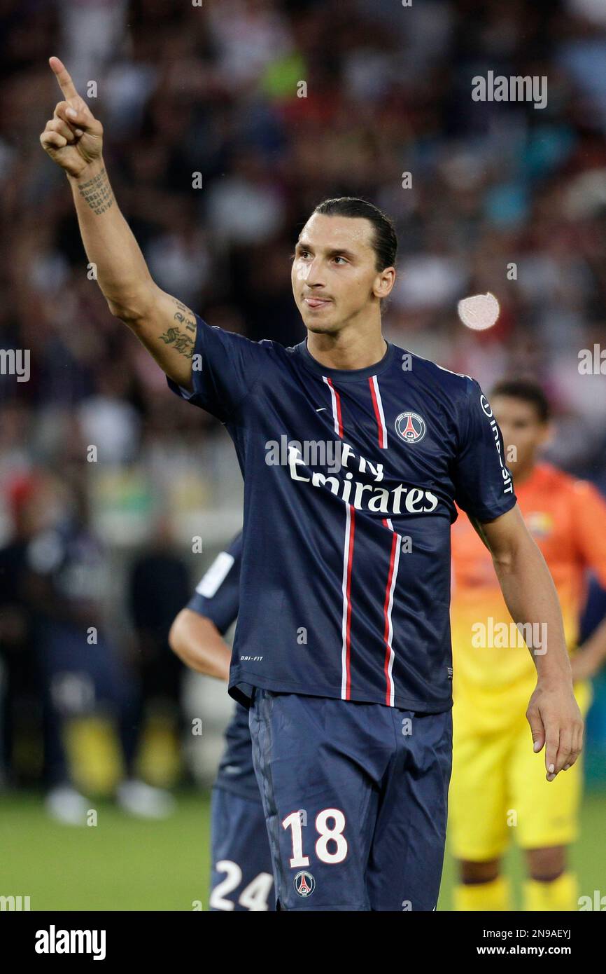 PSG s Zlatan Ibrahimovic reacts after scoring first goal for his team during a pre season friendly soccer match Paris Saint Germain against Barcelona at Parc des Princes stadium in Paris Saturday Aug....