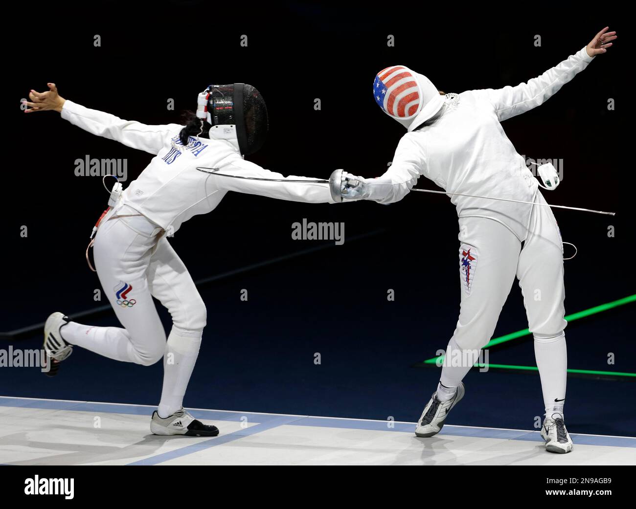 Russia's Lyubov Shutova, left, competes against the United States ...
