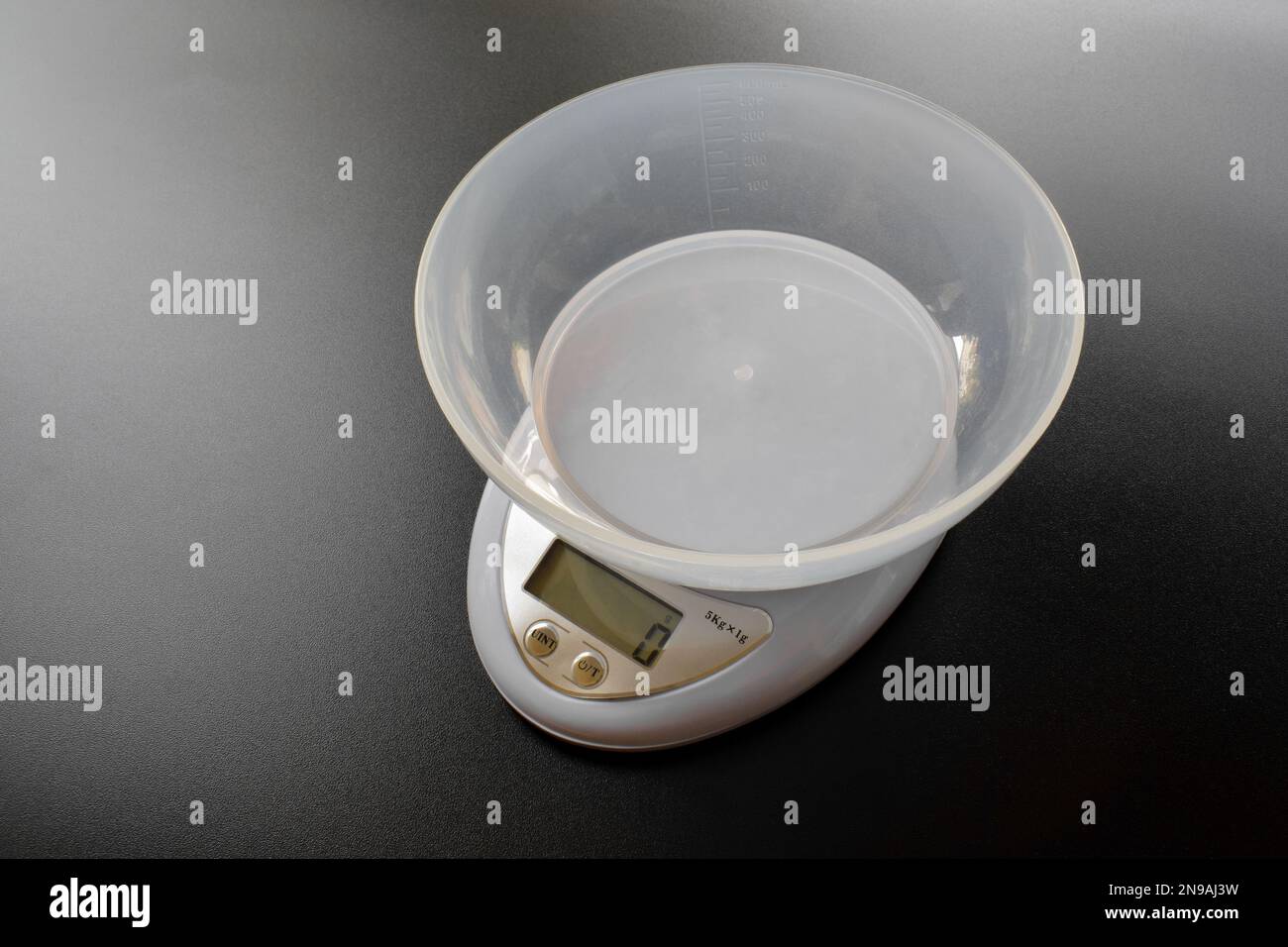Digital kitchen scales isolated on black background. (Electronic Scales) Stock Photo