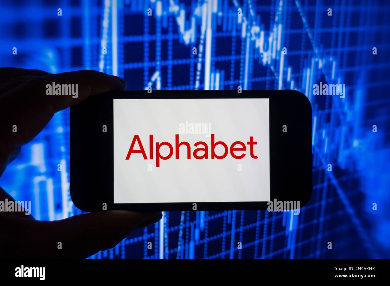 Digital composite image of Google Alphabet logo on phone scree. Stock Photo