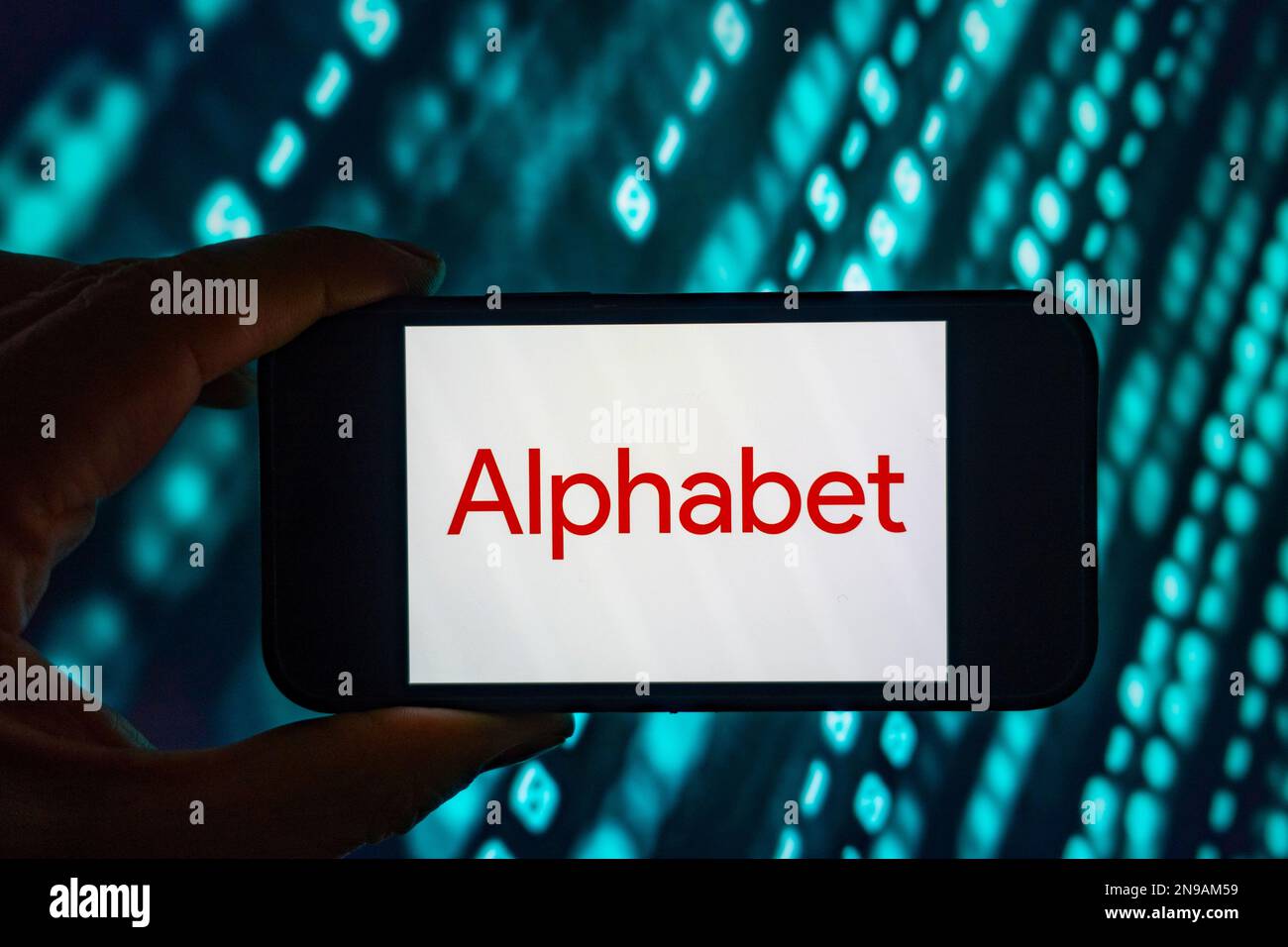 Digital composite image of Google Alphabet logo on phone scree. Stock Photo