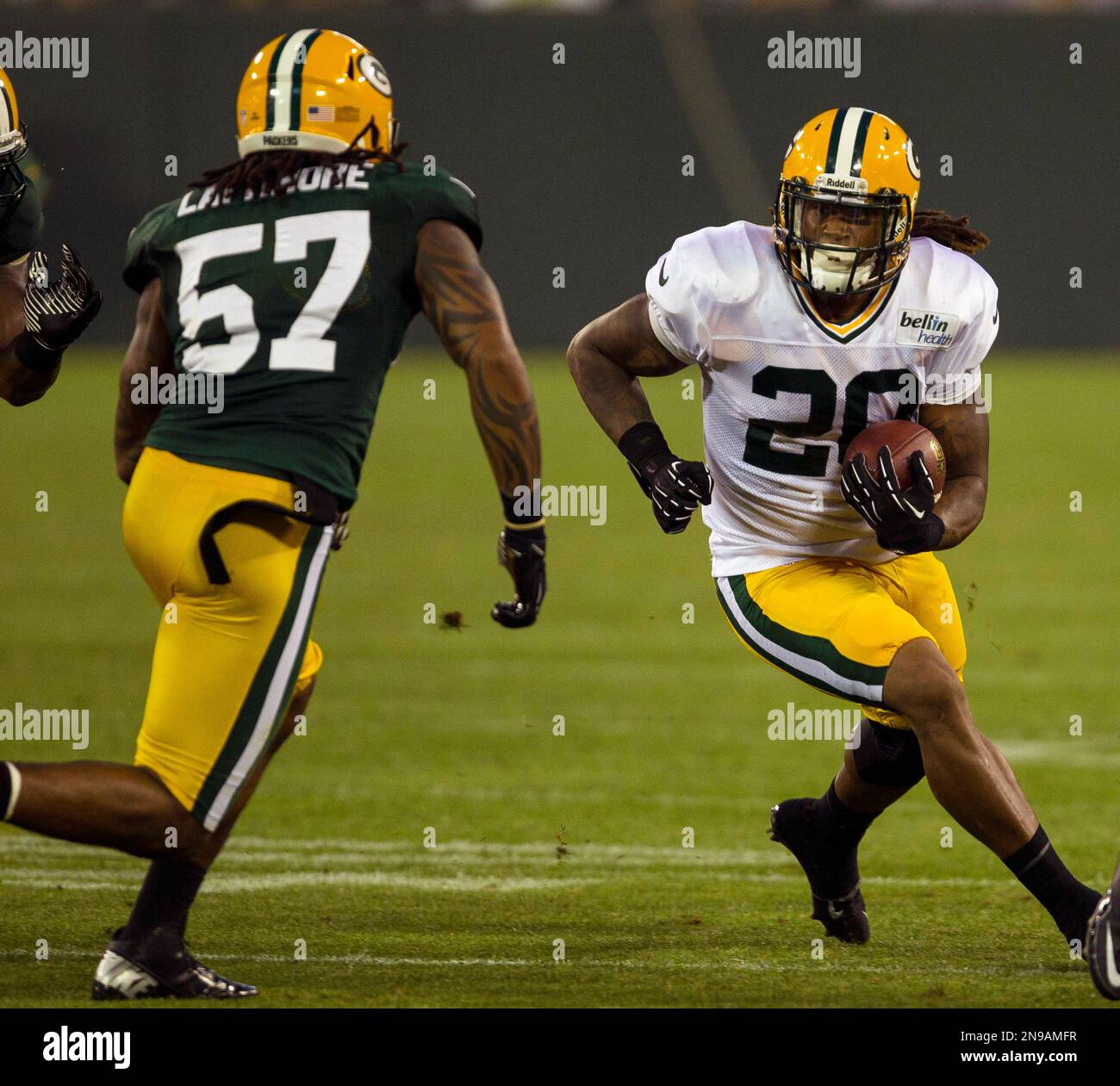 Green Bay Packers running back Alex Green (20) tries to elude
