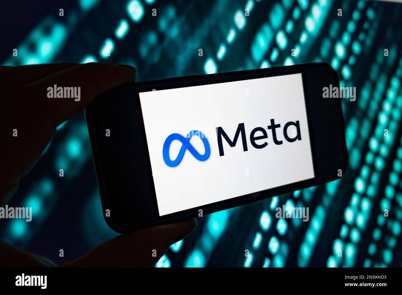 Digital composite image of Facebook Meta logo on phone scree. Stock Photo