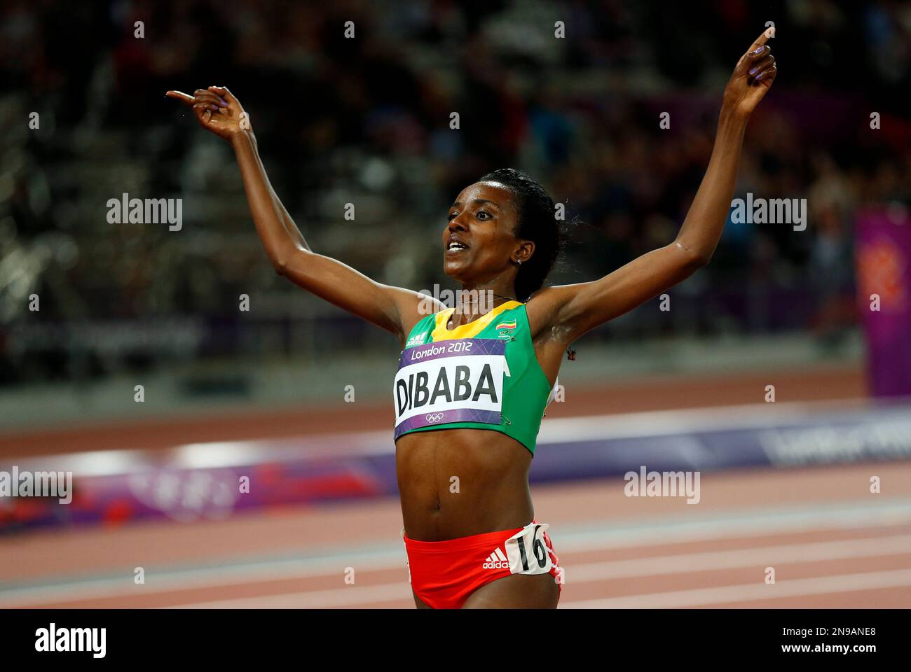 Ethiopia's Tirunesh Dibaba crosses the finish line to win the gold ...