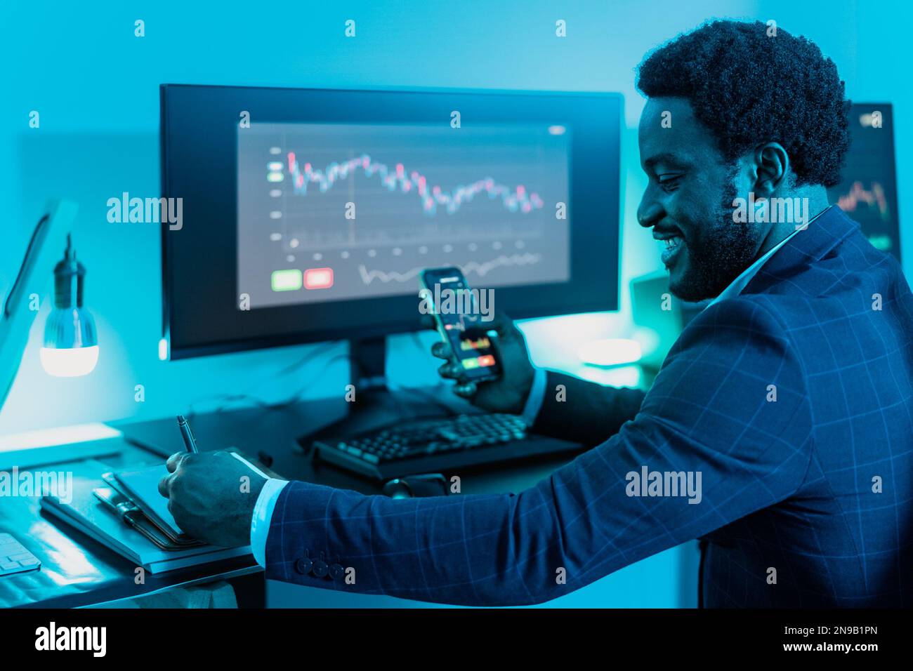 Financial analyst working on stock exchange market in modern office - Fintech concept Stock Photo