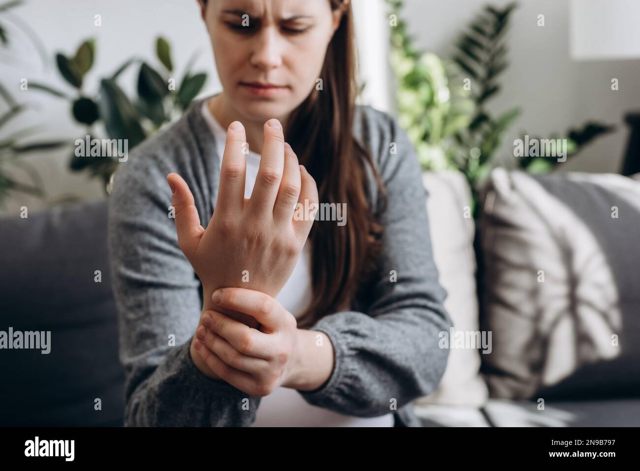 Selective focus of tired young pregnant female expecting baby suffering