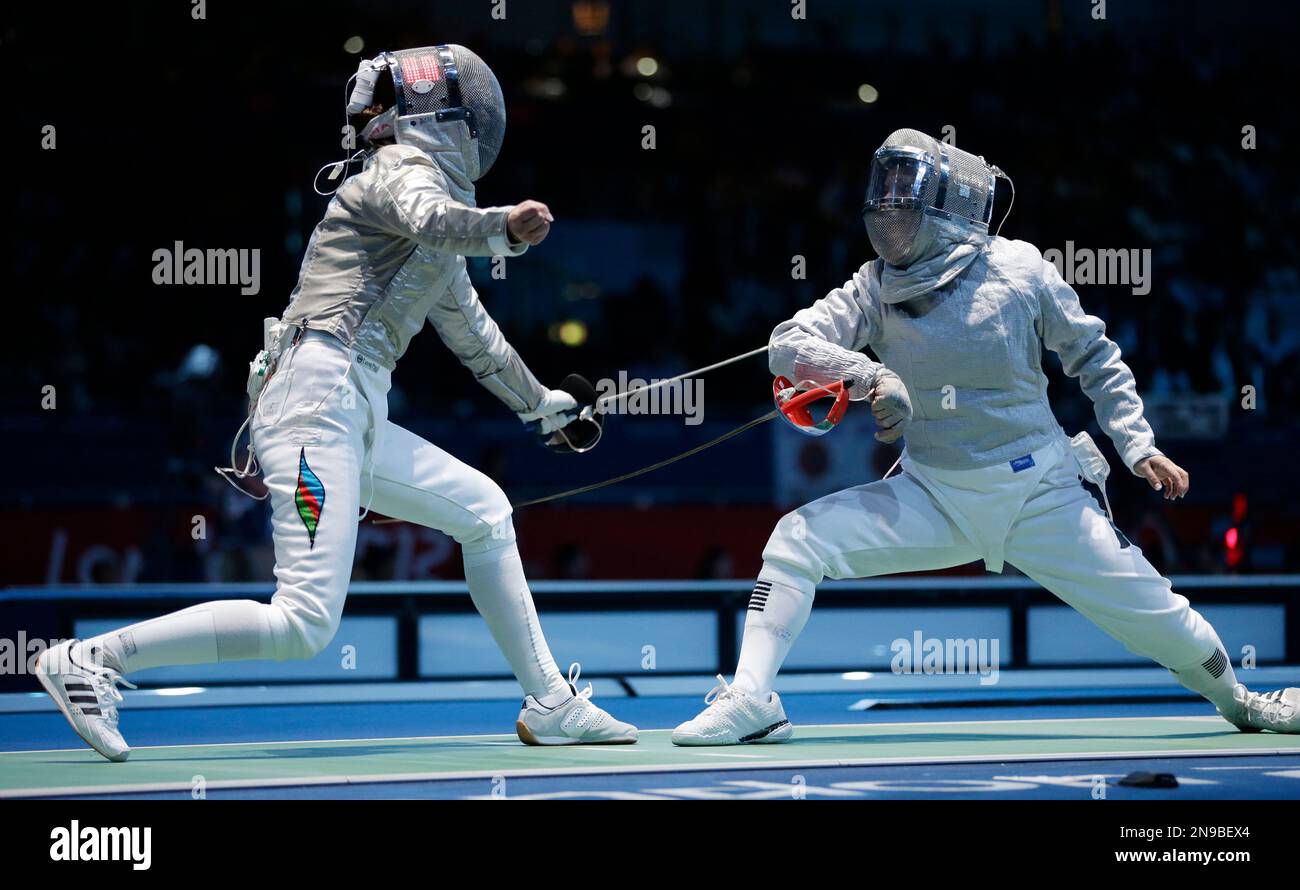 Azerbaijan's Sabina Mikina, left, competes with Germany's Alexandra
