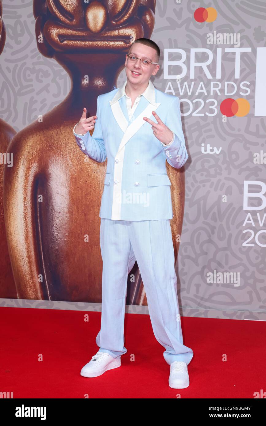 Aitch poses for photographers upon arrival at the Brit Awards 2023 in
