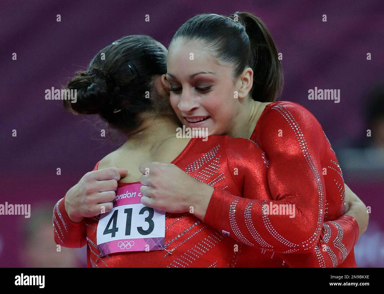 U.S. gymnast Jordyn Wieber, right, hugs teammate Alexandra Raisman after finishing her floor