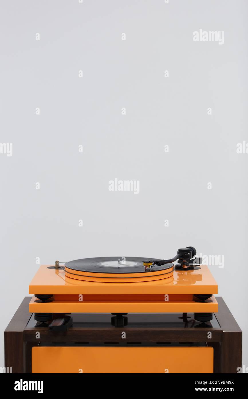 Modern hi fi turn table player. High fidelity turntable plays vinyl