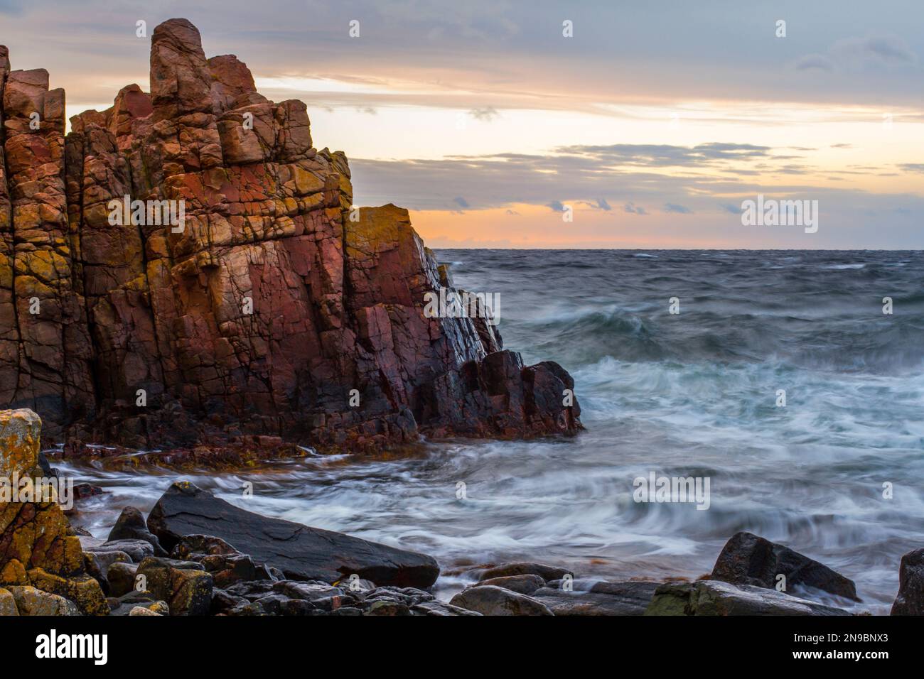 A huge rocky cliff on the coast of the sea in Hovs-hallar, Sweden Stock Photo