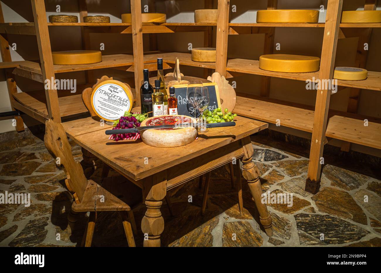 Ageing room where hard cheeses are stored to mature - Stock Image -  F023/1665 - Science Photo Library