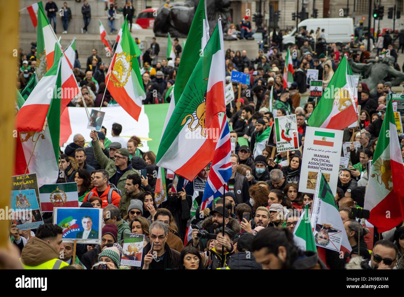 London, UK - 11 Feb 2023: As today marks the 44th anniversary of the Islamic Revolution in Iran. After more than five months of continuous protest in support of the woman, life, freedom movement, Thousands of protesters gathered in Trafalgar Sq. to denounce the Regime in Iran.  Protesters were mainly holding pictures of Mahsa Amini, and the Iranian Royal Family (Pahlavi) as well as the Shir-o-Khorshid (Lion and Sun) flag of Iran—the flag, or its emblem, were part of Iranian national identity for centuries—which was changed after the Islamic Revolution in 1979.   Credit: Sinai Noor/Alamy Live N Stock Photo
