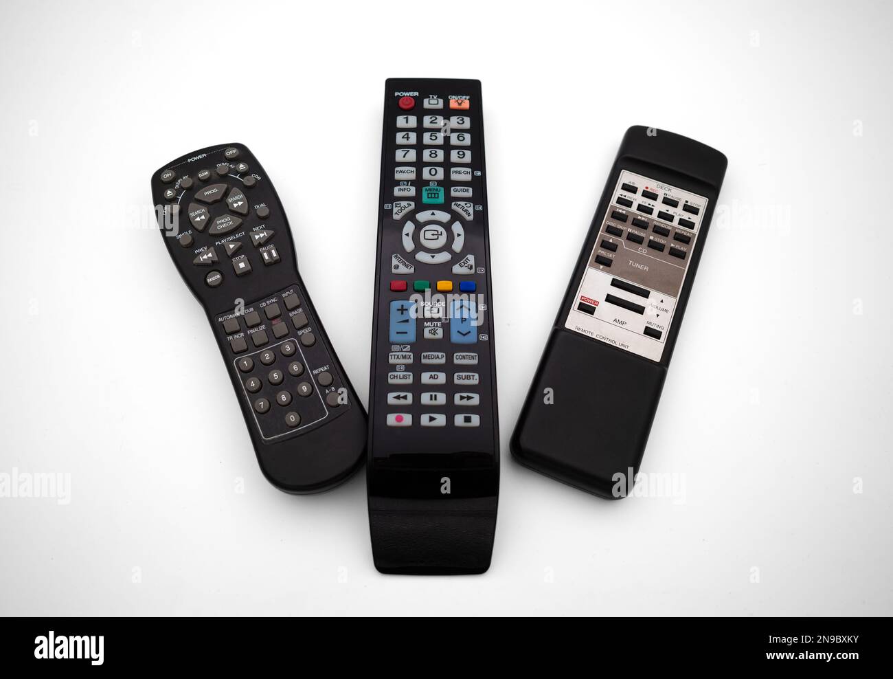 Various remote controls for TV and audio on white background Stock
