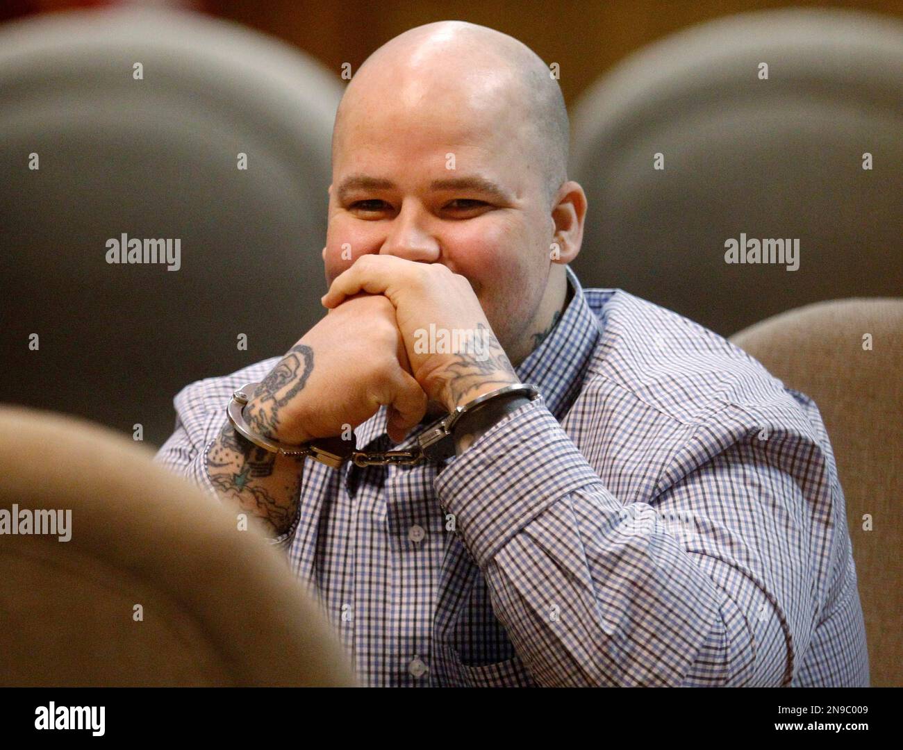 Handcuffed in the courtroom, Joshua Durcho sits during a break in a hearing  in El Reno, Okla., Monday, July 30, 2012. The hearing for Durcho, who is  accused of killing his girlfriend