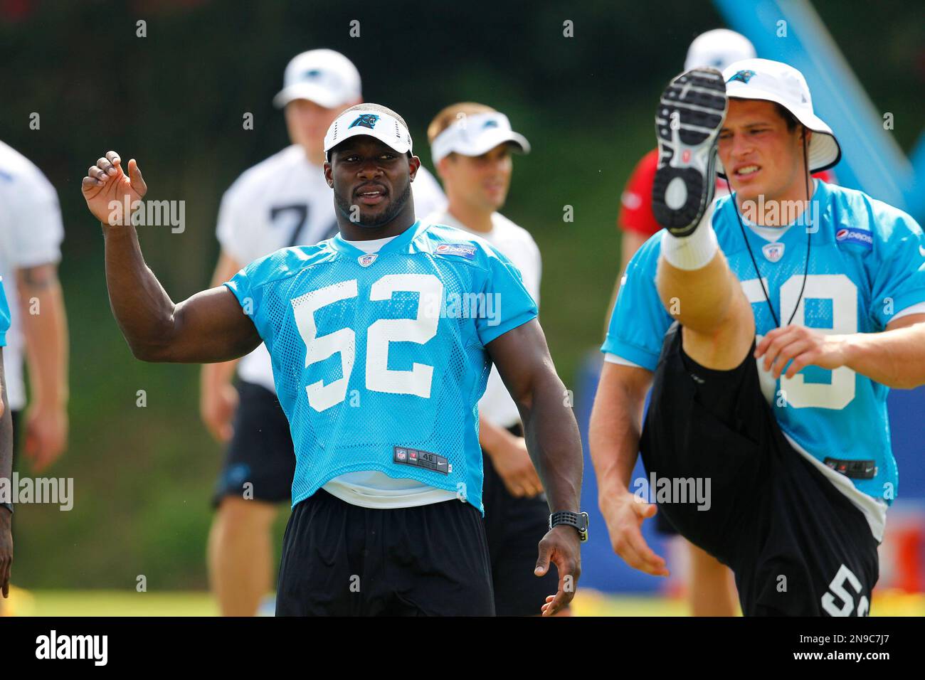 Carolina Panthers linebackers coach Ken Flajole gives instructions to  rookie Jon Beason during Beason's first practice at training camp in  Spartanburg, South Carolina, Monday, August 6, 2007. (Photo by David T.  Foster