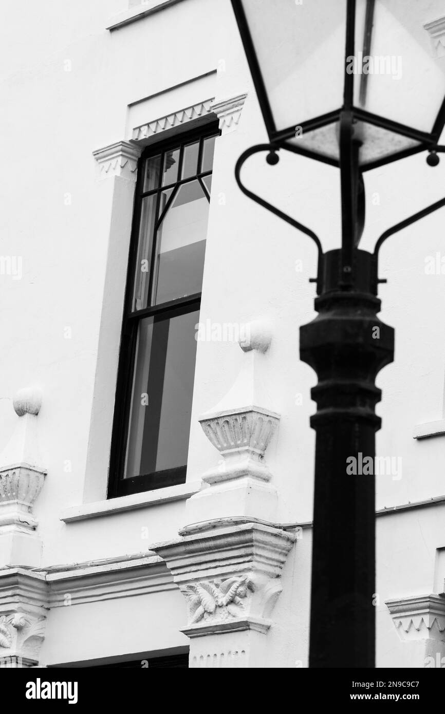 Northcote Mansions in Hampstead, London, UK. Beautiful residential white painted building with architectural detail. Stree lamp in foreground. Stock Photo