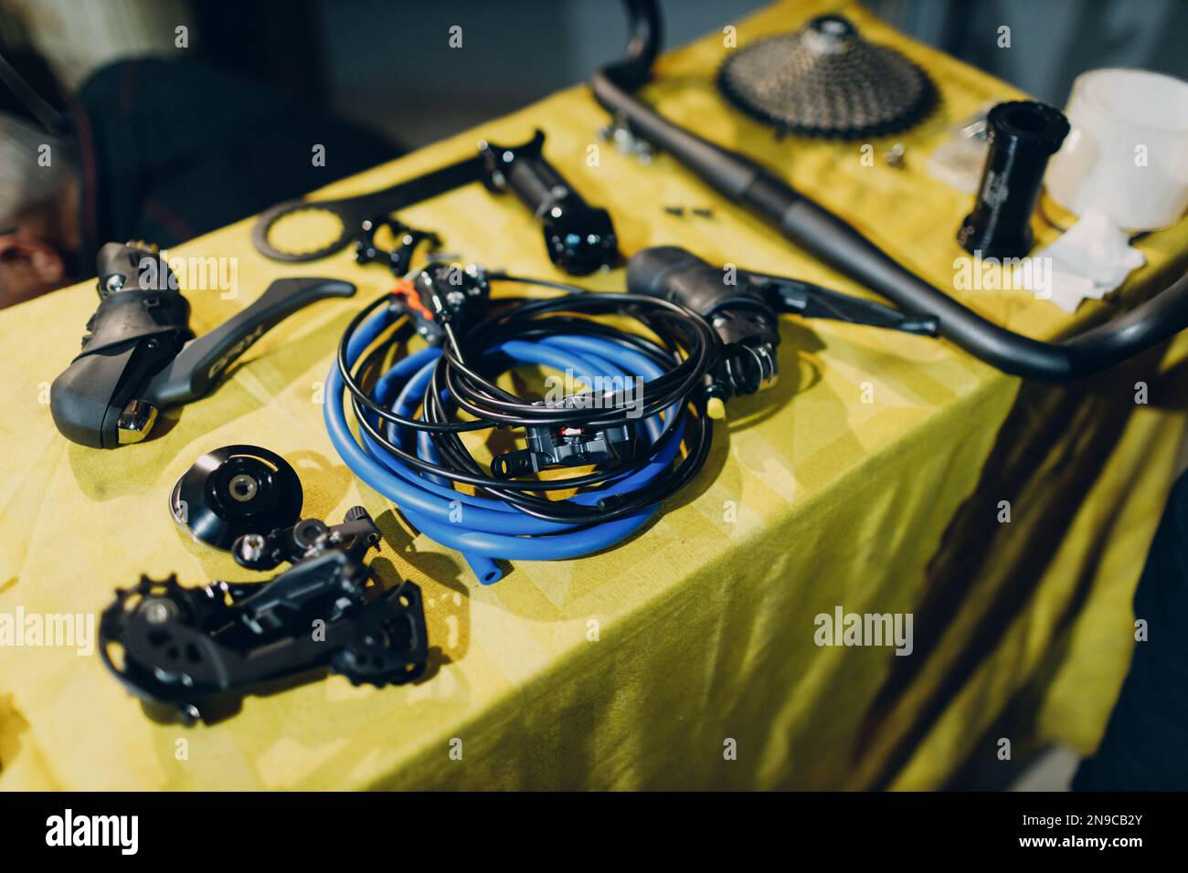 Bike assembling parts custom bicycle in workshop table Stock Photo