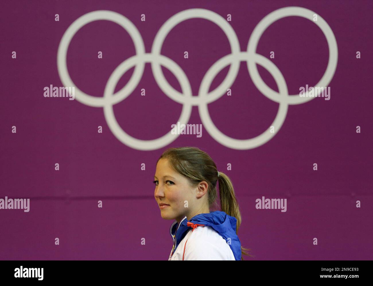 France's Celine Goberville walks past the olympic rings logo as she