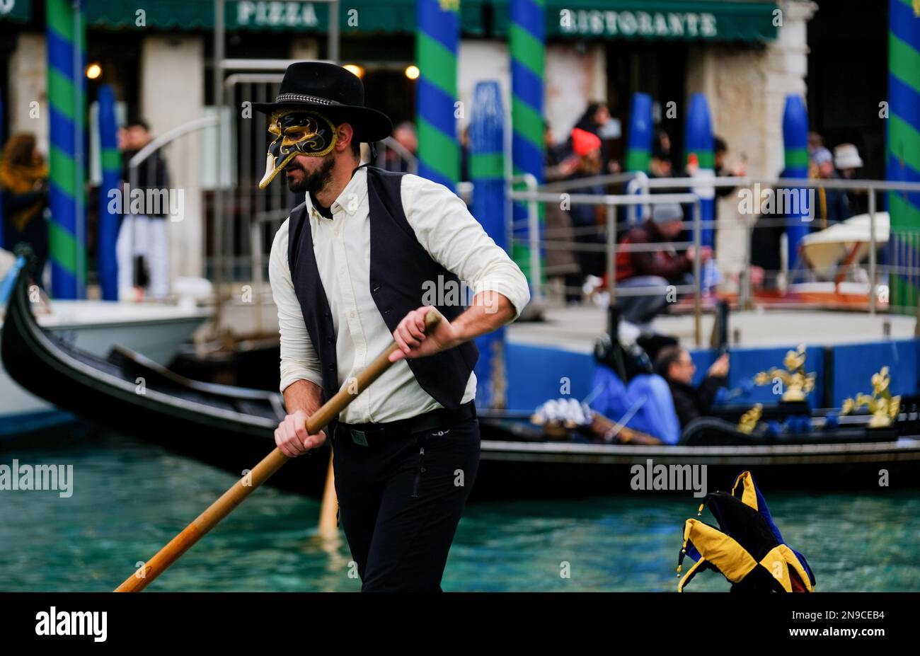 Venetians take part in the masquerade parade on the Grand Canal during the Venice carnival, in Venice, Italy February 5, 2023. Stock Photo