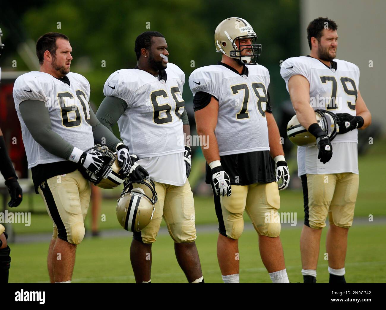 New Orleans Saints center Brian De La Puente (60), guard Ben Grubbs (66),  tackle Scott Winnewisser (78), and tackle Hutch Eckerson (79) watch drills  during training camp at their NFL football training