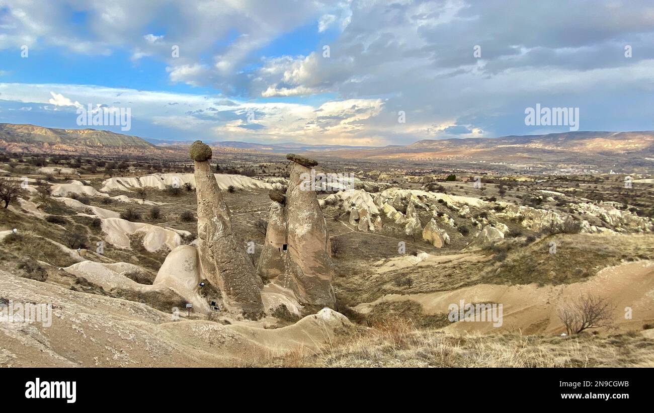 Three Graces, three Beautifuls (uc guzeller) rock hills in Devrent valley, Cappadocia, Nevsehir,  Turkey Stock Photo