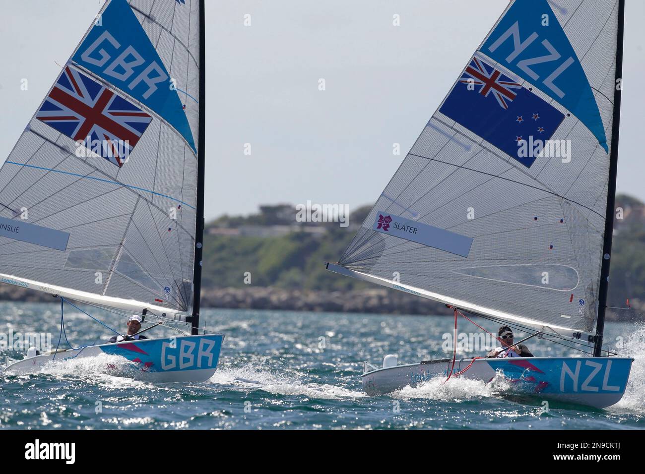 Ben Ainslie of Great Britain, left, and Dan Slater of New Zealand sail