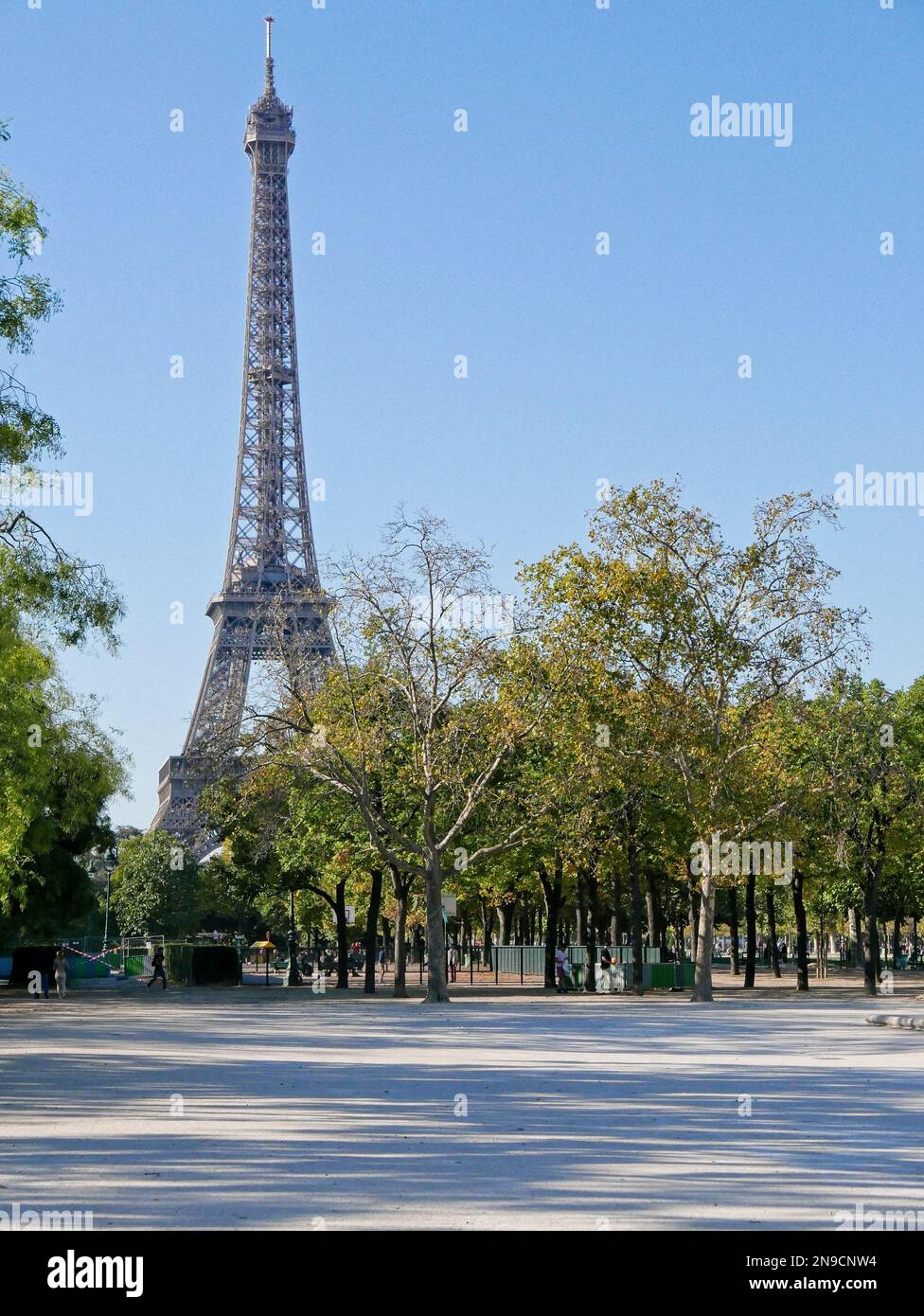 Eiffel tower in Paris France on a sunny day between trees Stock Photo