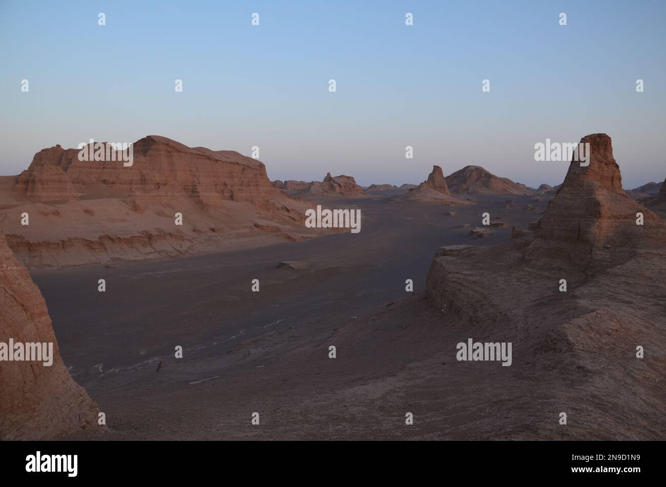 dry desert landscape of 'Kalouts desert', Iran in evening light Stock Photo