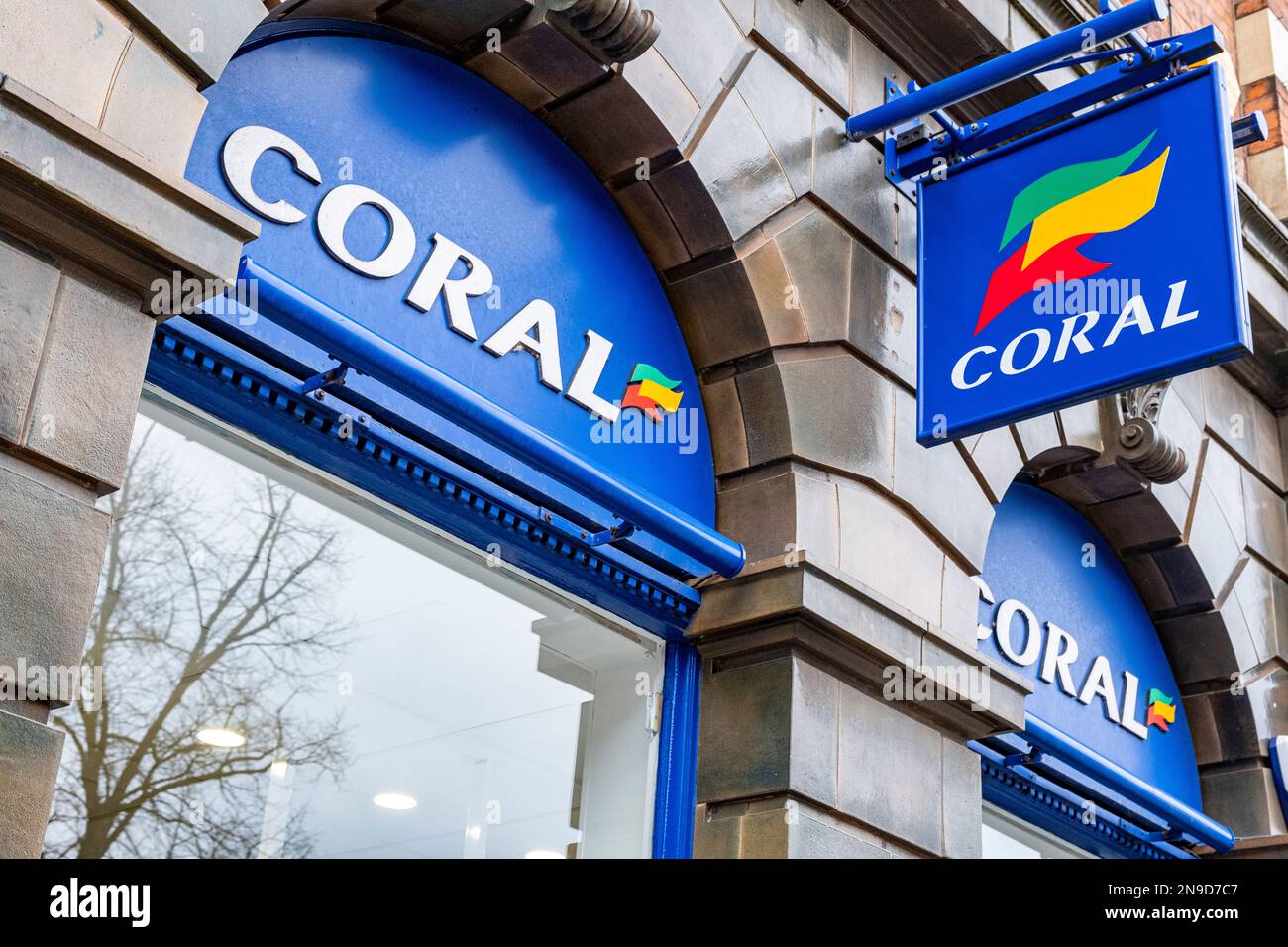 Coral betting shop sign or logo on outside wall UK Stock Photo
