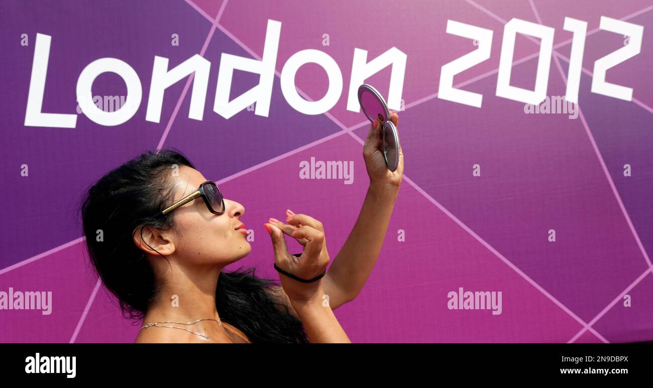 Dancing girl Jeanette Taylor of London applies makeup prior to ...