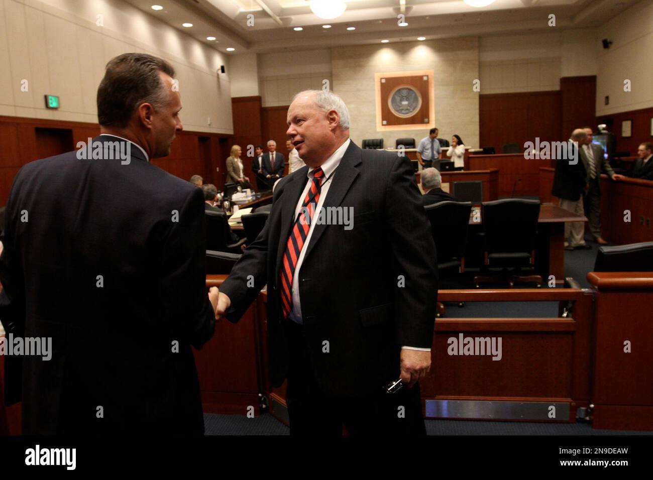 U.S. Ninth Circuit Judge N. Randy Smith, right, visits with courtroom