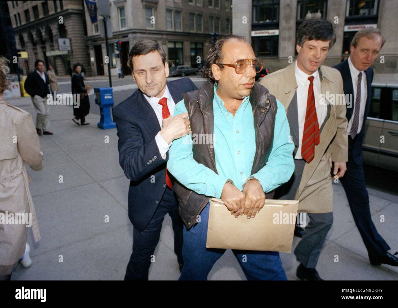Raymond Patriarca Jr., the alleged boss of the Patriarca crime family, is led by federal agents