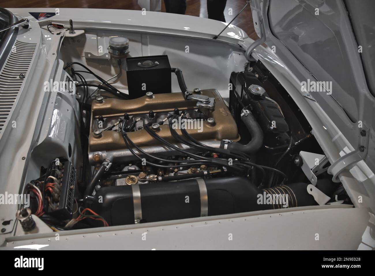 A close-up of the engine of a white classic Alfa Romeo rally car Stock Photo