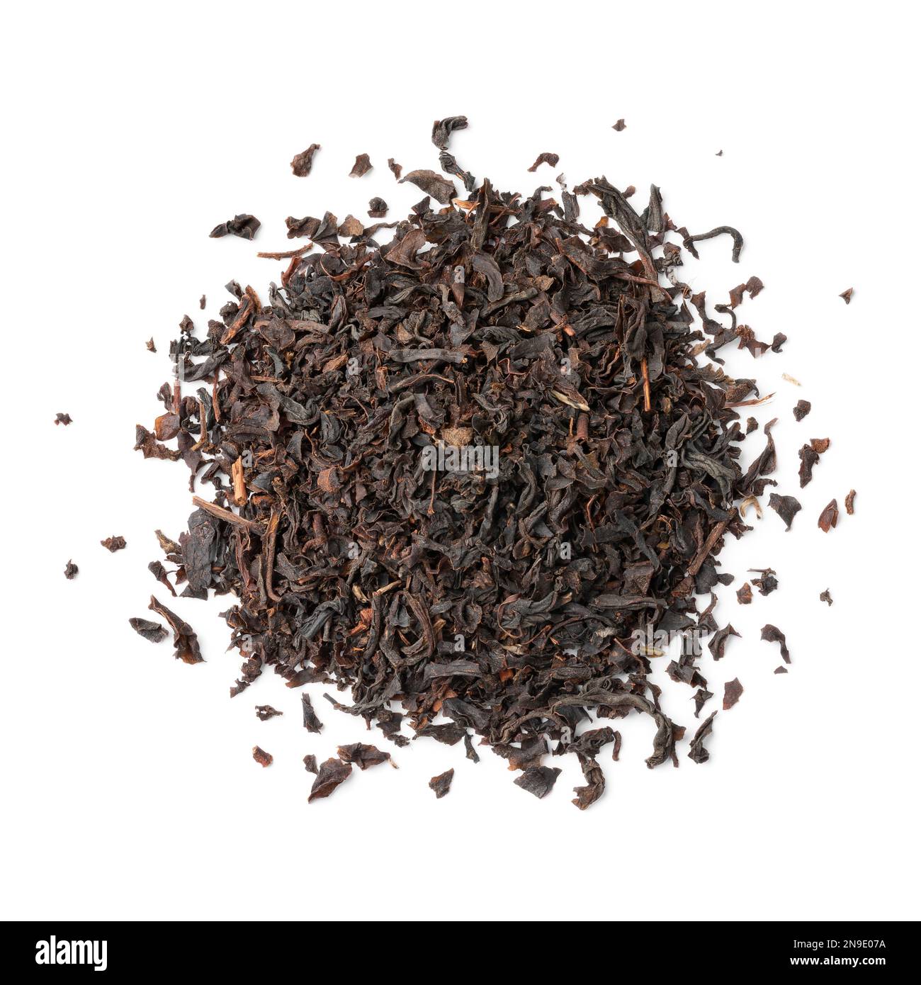 Heap of Indonesian Java Melange dried tea leaves close up isolated on white background Stock Photo