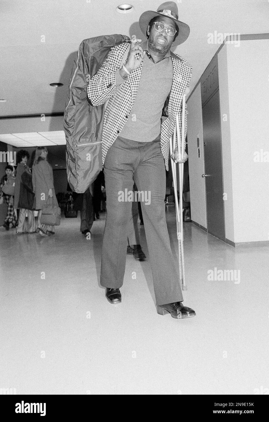 Willis Reed walks through the terminal at JFK airport in New York with ...